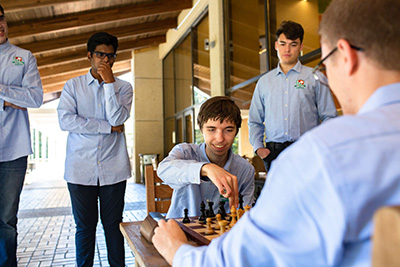 David Brodsky playing chess in front of the Student Union.
