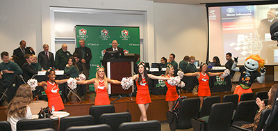 Cheerleaders perform at a chess tournament.