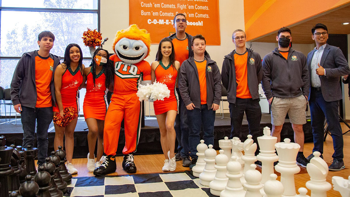 Chess Team poses with a UTD cheerleader and Temoc, the UTD mascot.